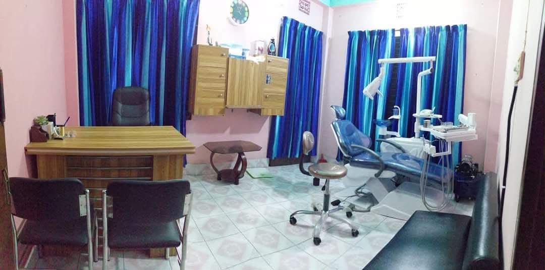 The treatment room at Anowar Dental with a dental chair and consultation desk